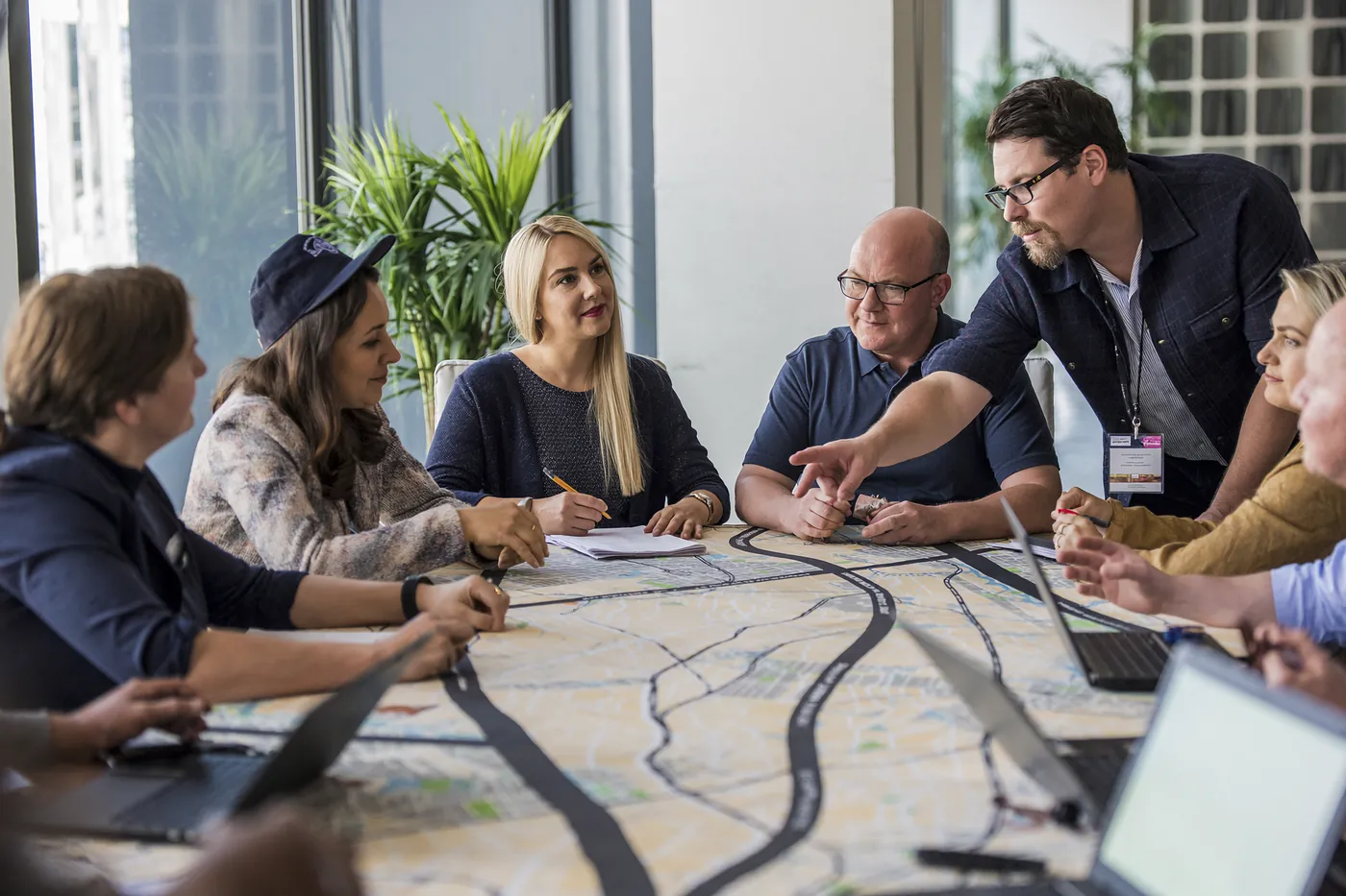 An events team working over a printed street map