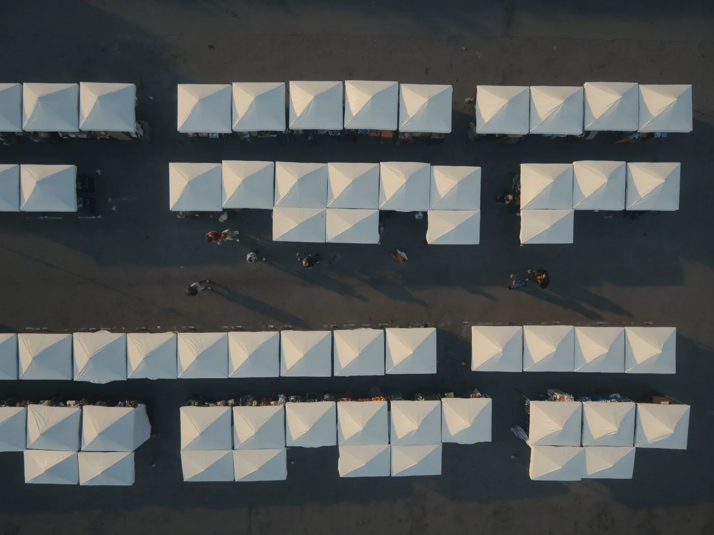 Overhead view of vendor tents lining a street fair